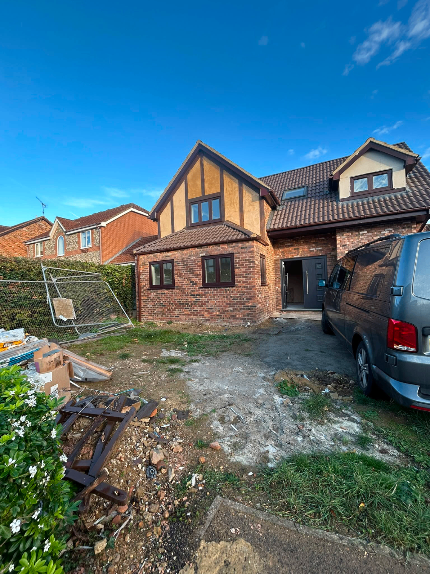 Detached house renovation — front elevation with new brickwork and rendering