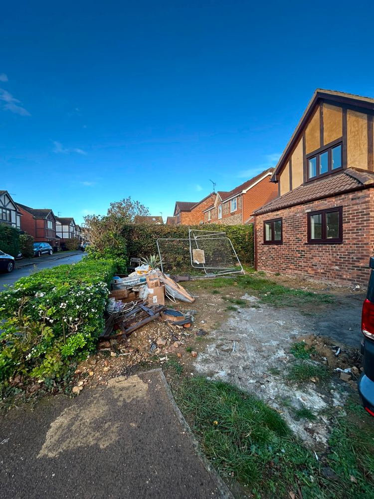 Detached house renovation — side view showing extension and roofing